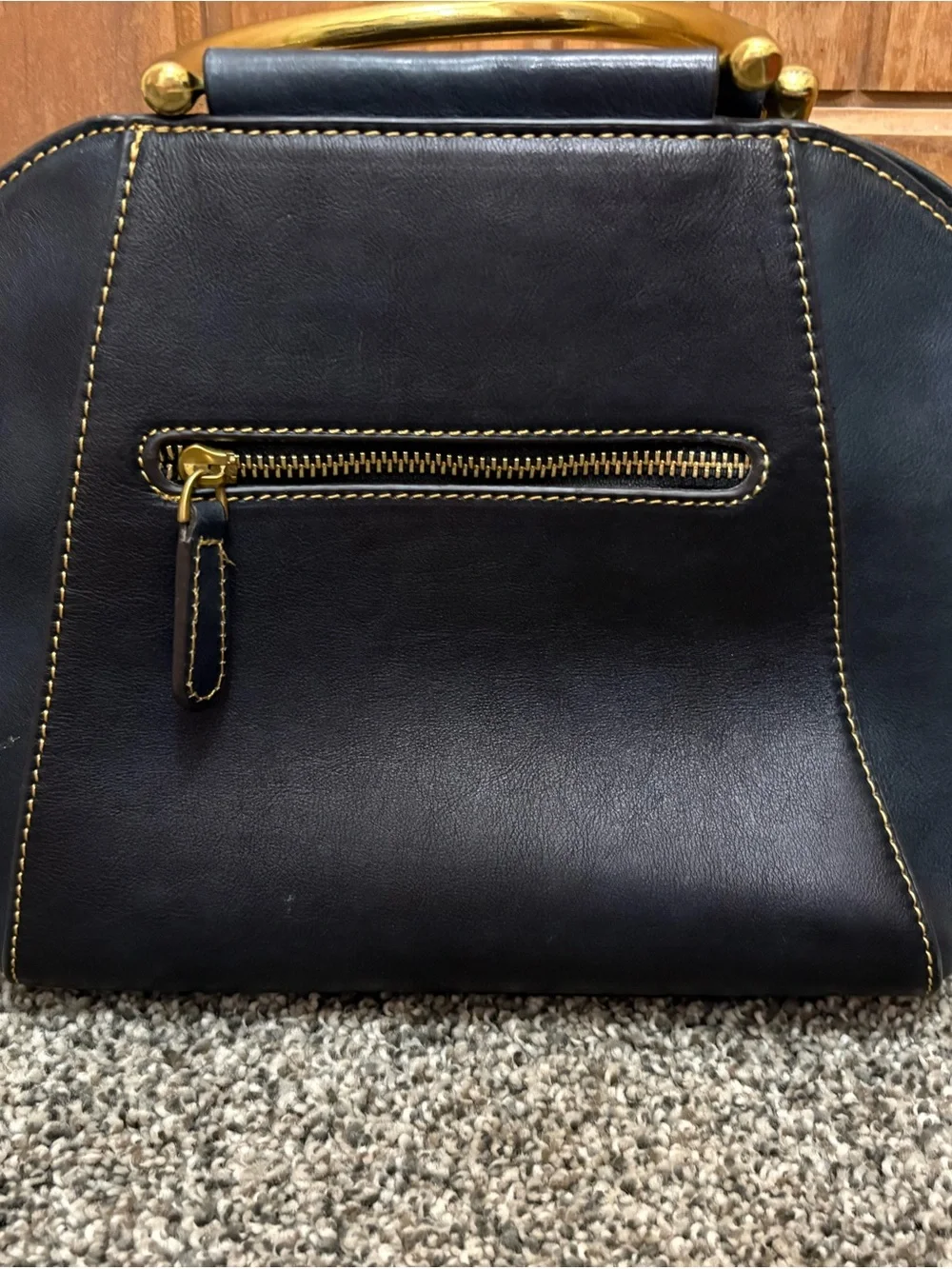 Source Unknown Black Leather Shoulder Bag with Gold Embossed Medallion